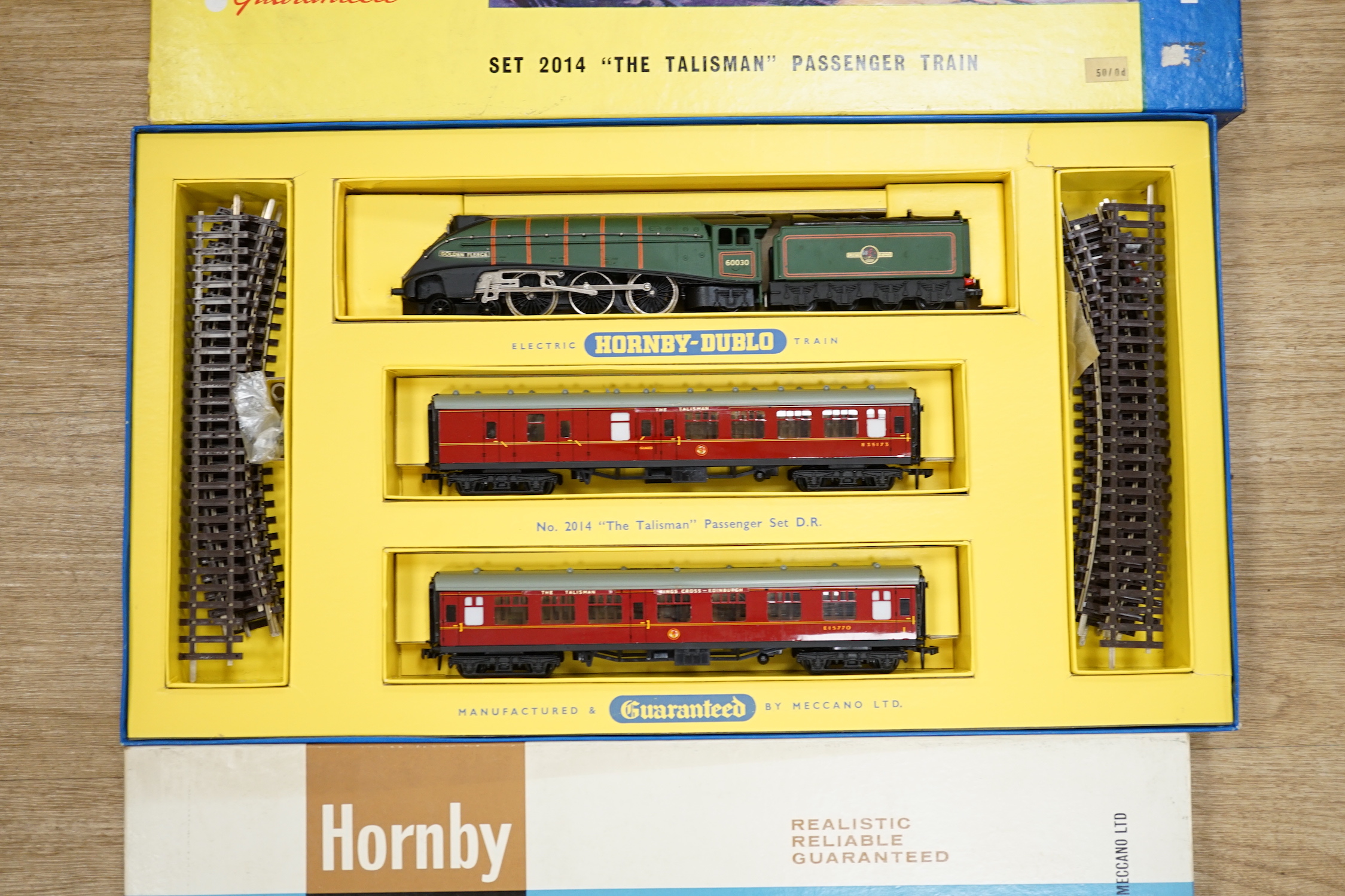 Two boxed Hornby Dublo 2-rail train sets; Set 2014 ‘The Tallisman’ Passenger train set and Set 2033 Co-Bo Diesel Electric Goods Train set